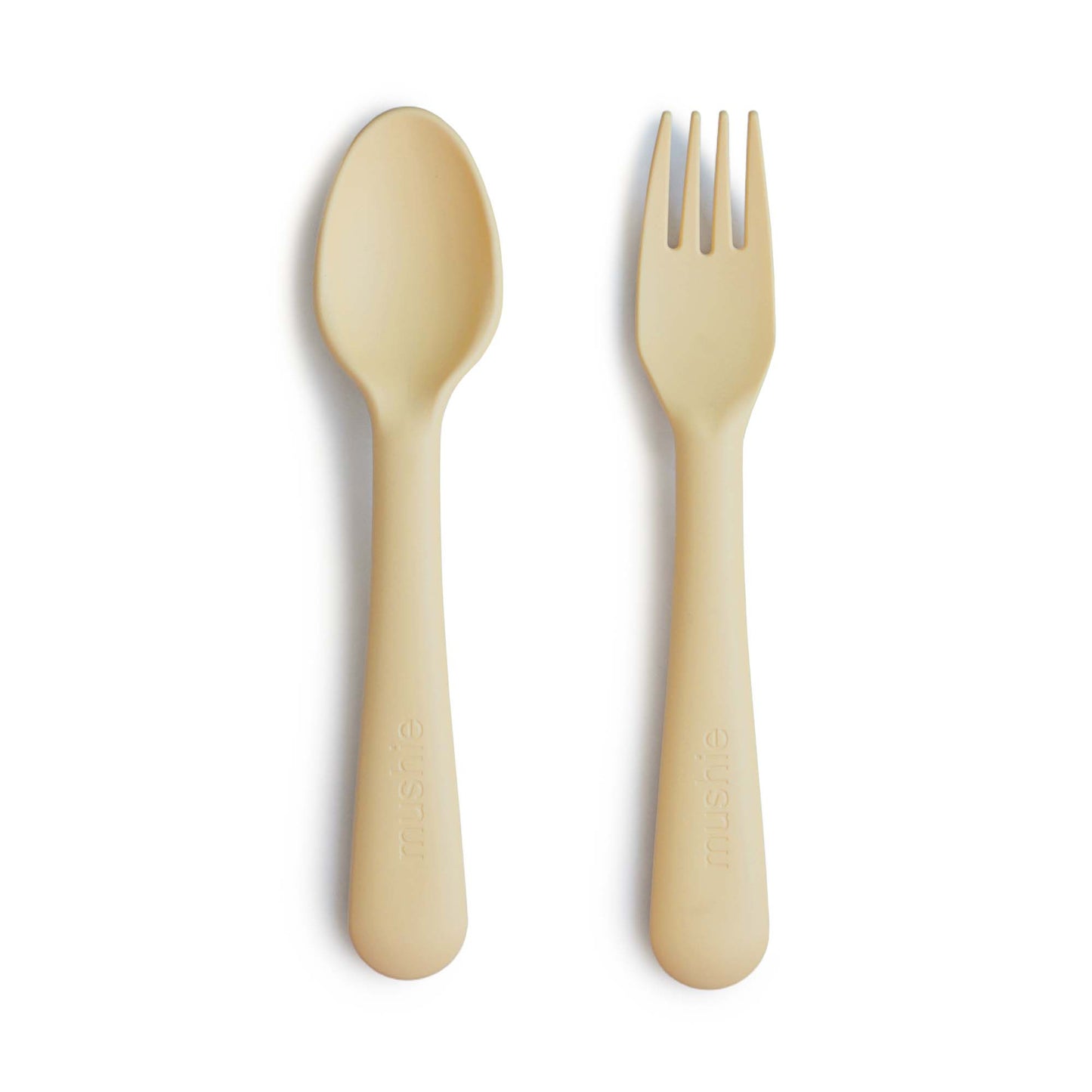 Mushie bestek vork en lepel (fork and spoon) in kleur Pale daffodil, gemaakt uit siliconen van het merk Mushie